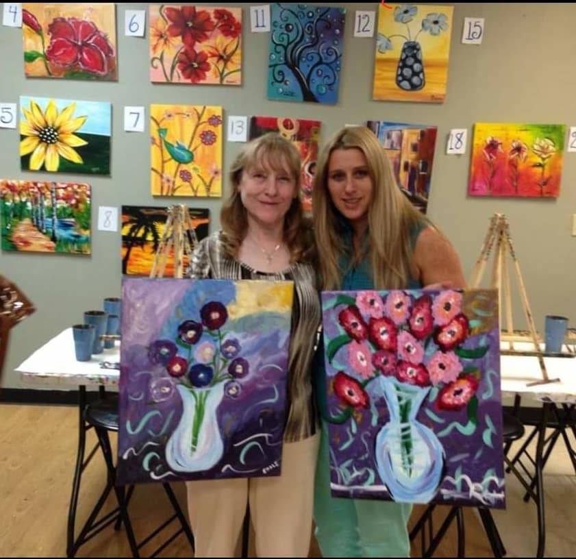 Painters with floral canvases